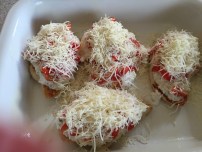 Add ricotta mixture, tomatoes, and mozzarella