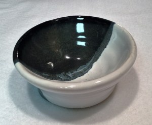 this three-color look is achieved by dipping the bowl into two different glazes. The overlap creates the third color.